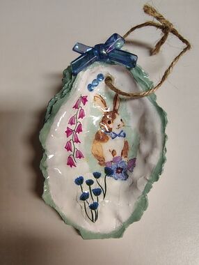 Decoupaged and resined bunny oyster shell with embellishments trinket holder
